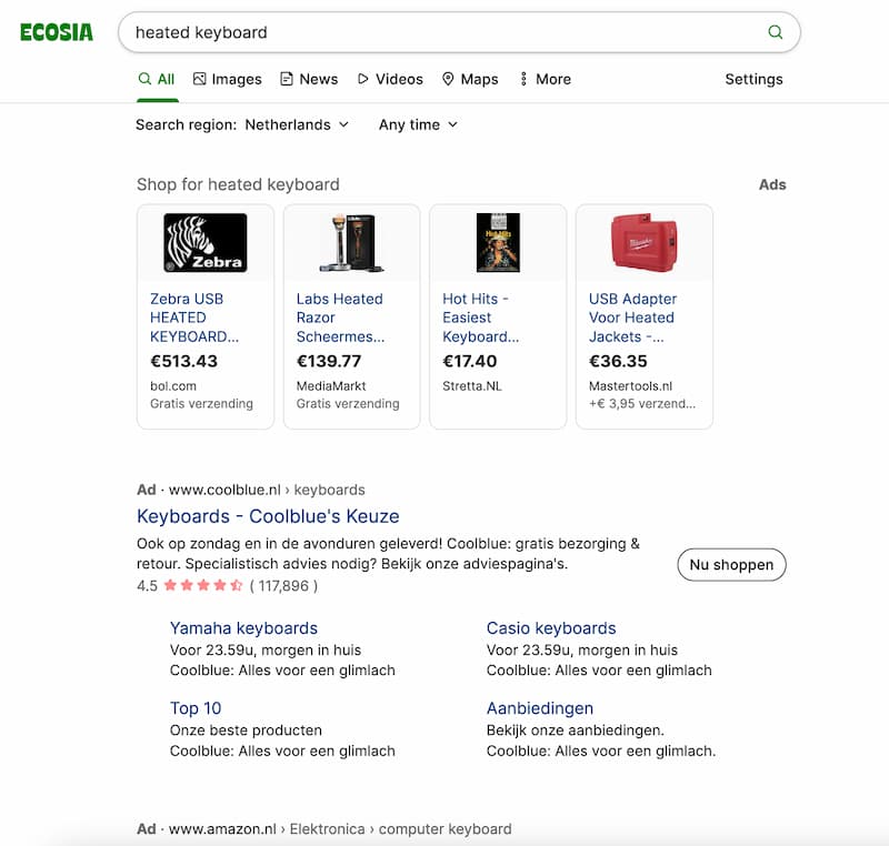 An example of SEA: The Ecosia search results for "heated keyboard" include two ads near the top of the page.